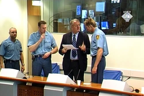 Vojislav Seselj standing in the courtroom 